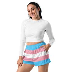 Add these cute transgender flag shorts to your trans pride wardrobe. These trans flag shorts are a great way to show off your transgender pride and gender identity. Not only are they super cool for pride events and festivals, they are functional athletic shorts made for swimming, running and other sporting activities and you'll won't want to be without them when heading to the beach or lounging by the pool. You'll also appreciate the mesh pockets large enough to hold your phone. DETAILSComfortable elastic waistband with a flat white drawstringDeep mesh side-pocketsWater-repellent microfiber fabricMoisture wickingBreathable & fast dryingUPF50+ protectionMATERIAL91% recycled polyester, 9% spandex (composition may vary by up to 3%)Model wears size MHeight 5.5 feet (165 cm), waist circumferenc Moisture-wicking Shorts For Cheerleading In Summer, Summer Cheerleading Athletic Shorts, Pink Shorts With Built-in Liner For Cheerleading, Sporty Cheerleading Shorts For Summer, Sporty Shorts For Summer Cheerleading, Summer Athleisure Cheerleading Shorts, Moisture-wicking Athletic Shorts For Cheerleading In Summer, Summer Moisture-wicking Athletic Shorts For Cheerleading, White Athletic Shorts For Cheerleading In Summer