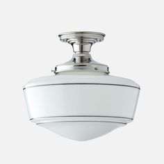 a ceiling light with a white glass shade