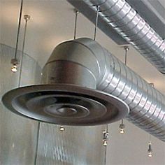 an industrial ventilation fan hanging from the ceiling