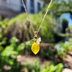 Brighten up your look with our customized handmade Czech glass lemon necklace! 🍋Can't find your perfect chain length? Has requirement on the material? We offer custom fruit necklace. How to personalize your necklace? You choose the design; we hand make the necklace. Material: handmade with Czech glass lemons, acrylic flowers, acrylic leaves, and 14K gold plated/925S silver plated (hypoallergenic) chain. Size: The lemon pendant is about ( W x L) 0.8cm x 2cm. Can't find your perfect chain length? Lemon Necklace, Coworker Appreciation, Acrylic Leaves, Flowers Acrylic, Fruit Necklace, Necklace Design, Acrylic Flowers, Unique Gifts For Her, Citrus Fruit