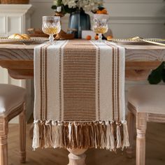 a dining room table set with place settings