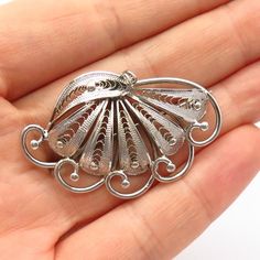 925 Sterling Silver Vintage Filigree Fan Design Pin BroochWeight: 7.2gWELCOME TO PAWN SHOPWe are an actual pawn shop and have been in business for over 25 years.Since 1990, our establishment has been serving a variety of clients by providing them with short term cash solutions and options of liquidity regarding their treasured heirlooms.Acknowledging that today′s customers are very sophisticated and are looking for a variety of investments, our acquisitions are hand-picked for our special client Luxury Engraved Brooches For Gift, Vintage Filigree Pendant Brooch, Vintage Filigree Pendant Brooches, Vintage White Gold Brooch With Intricate Design, Antique White Gold Filigree Brooch, Antique White Gold Filigree Brooches, Silver Sterling Silver Pendant Brooches, Ornate Filigree Brooches For Collectors, Silver Engraved Victorian Brooches