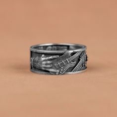 Unique Rockn Roll Tehemed Silver Band Rings, Guitar Engraved Band Ring, Punk Style Men Band Ring, Electric Musical Gift Rings, Birthday Gift   Made of 925 silver and handcrafted by hand, this ring is not only an accessory piece that complements your daily elegance, but also has details that will reflect your character and style. It is also a great gift to give to your loved ones on their special days. At SavisSilver, we always give importance to the satisfaction of our customers, we recommend yo Adjustable Punk Band Jewelry, Music Jewelry Rings, Guitar Rings Men, Music-themed Silver Rings For Gifts, Music-themed Silver Rings For Gift, Punk Style Men, Guitar Ring, Musical Gift, Style Punk