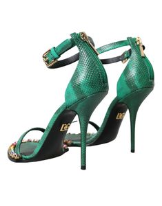 Dolce & Gabbana ankle strap heels sandals with crystal embellishment. Made from high-quality exotic leather, these sandals feature a chic crystal embellishment that will elevate any outfit. Expertly crafted in Italy, they also boast a durable leather sole and a convenient buckle closure to keep your feet secure and comfortable throughout the day. Model: Heeled sandals Color: Green Material: Leather Sole: Leather Buckle closure 100% Exotic Snakeskin Leather Made in Italy Luxury Embellished Ankle Strap Heels, Luxury Crystal Embellished Ankle Strap Sandals, Designer Embellished Sandals With Open Heel, Luxury Crystal-embellished Heels For Summer, Luxury High Heel Embellished Sandals, Luxury Embellished High Heel Sandals, Designer Embellished Ankle Strap Heels, Designer Embellished Heels With Ankle Strap, Designer Embellished Sandals For Gala