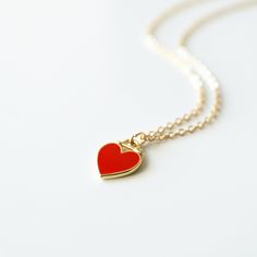 "Beautiful and lovely red heart charm necklace. Made of red enamel gold heart charm with skinny gold plated brass chain. Simple and warm. Great for gift, everyday or special occasion. Please choose chain color and length. Your item will ship in a gift box. Please feel free to contact me if you have any questions. ♥ Chain length available 14\" - 20\" ♥ Red heart 3/8\" ♥ Gold plated over brass/enamel ♥ See more Rudiana Accessories Rudiana.etsy.com" Enamel Heart Charm Necklace For Valentine's Day, Red Enamel Charm Necklaces For Gifts, Red Heart Pendant Necklace For Everyday, Dainty Red Charm Necklace For Everyday, Valentine's Day Gift Enamel Charm Necklaces, Valentine's Day Gift Enamel Charm Necklace, Red Enamel Heart Pendant Necklace, Enamel Heart Charm Necklace For Gifts, Valentine's Day Gift Enamel Heart Necklace