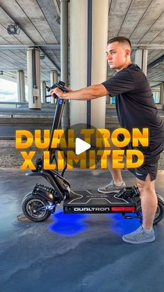 a man riding an electric scooter with the words dualtron limited on it