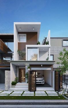 a car is parked in front of a modern house with balconies on the second floor