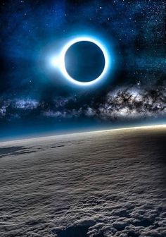 an artist's impression of a solar eclipse in the sky over clouds and earth