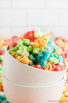 a bowl filled with colorful cereal on top of a table