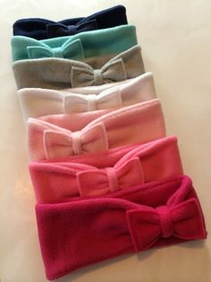 four different colored headbands with bows on them