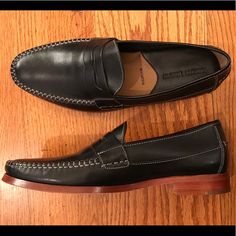 This Is A Sharp Looking Johnston & Murphy Loafer With A Black Leather Upper And Strap Across The Top Of The Shoe. There Is A Cushioned Insole With Good Arch Support. Nwot, Store Display Wear. Size 8.5m, Confirm Length Of 11.25 Inches. #Petfree #Smokefree Classic Black Slip-ons With Stitched Sole, Fitted Almond Toe Moccasins With Rubber Sole, Fitted Moccasins With Rubber Sole And Round Toe, Black Leather Slip-ons With Goodyear Welt, Classic Black Loafers With Leather Footbed, Black Goodyear Welted Slip-ons For Work, Fitted Black Wingtip Loafers, Black Goodyear Welted Moccasins With Round Toe, Black Goodyear Welted Round Toe Moccasins