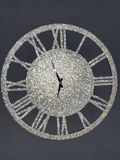 a large clock with sparkling numbers on the face