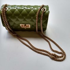 Assortment Of New Handbags In Leather, Clear Rubber, Patent Leather With Gold Chain Strap Designer Green Shoulder Bag With Chain Strap, Designer Green Bag With Chain Strap, Luxury Green Bag With Chain Detail, Luxury Green Bag With Chain, Luxury Green Chain Bag, New Handbags, Michael Kors Jet Set, Chain Strap, Gold Chain