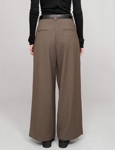 Brown wide-leg suit pants . Styled with matching oversized blazer. 69% polyester, 29% viscose, 2% spandex Baggy fit Wide LegHigh-waist side pockets Faux back pocket Total length 41.5"/ 105 cmModel wears size S and is 5.8"/172 cmImported Fall Wide-leg Pantsuit With Welt Pockets, Fall Wide Leg Pants With Welt Pockets, Fall Wide Leg Work Pants, Fall Wide Leg Workwear Pants, Fall Workwear Wide Leg Trousers, Tailored Full Length Wide Leg Fall Pants, Fall Business Casual Wide-leg Dress Pants, Baggy Wide-leg Dress Pants For Workwear, Baggy High-waisted Wide Leg Pants For Work