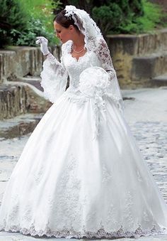 a woman in a wedding dress is walking down the street