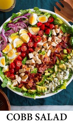 cobb salad with hard boiled eggs, bacon, lettuce, tomatoes and avocado