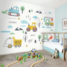 a child's bedroom decorated in blue and green with construction vehicles on the wall