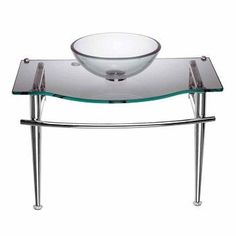 a glass bowl sink sitting on top of a metal stand