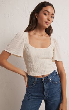 Z Supply Women's Ribbed Novelty Knit Top Maxine Knit Top Introducing the Maxine Knit Top: a square neckline top crafted from textured knit fabric for a bold look. Featuring short flowy sleeves and a waist length, this top is sure to turn heads and is perfect for any occasion. Shop more from Z Supply here. Details Available in sizes XS-L Color: Sandstone or Black Textured knit fabric Square neckline Short flowy sleeves Waist length Fabric 93% Polyester, 7% Spandex Sizing XS: 0-2, S: 4-6, M: 8-10, Textured Tops Women, Square Neckline Top, Shooting Ideas, Rib Knit Top, Long Sleeve Outerwear, Day Spa, Flowy Sleeves, Ribbed Knit Top, Knit Tops