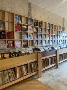 an old record store with many records on the wall and shelves full of vinyls