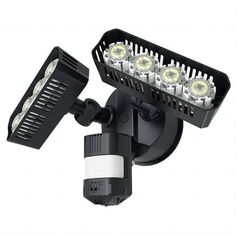 the led flood light is mounted on an outdoor wall fixture with two lights and one bulb