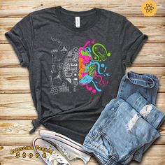 "All T-Shirt apparel are printed using direct-to-garment (also known as DTG). In addition, our inks are water-based and eco-friendly. This makes them feel much softer than traditional screen printed shirts but just as durable. Art Mind Shirt, Colorful Brain Science And Art, Left and Right Brain, Brain Shirt, Brain and Art Unisex Shirt, Art Lover, Science Teacher **All sales are final and we don't accept returns. this is a customized and personalized product, and can not be resold. If we made a m Multicolor Graffiti Print Cotton T-shirt, Casual T-shirt With Letter Print For Artistic Expression, Multicolor Relaxed Fit T-shirt With Graffiti Print, Artistic Cotton Tops With Graffiti Print, Artsy Multicolor Screen Print T-shirt, Artsy Multicolor T-shirt With Sublimation Print, Cotton Art With Graphic Print For Artistic Expression, Casual Graphic Design T-shirt For Artistic Expression, Cotton T-shirt With Multicolor Graffiti Print