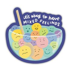 a bowl filled with lots of different colored smiley faces and words that say it's okay to have mixed feelings