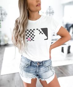 Show your love for the game with our Checkered Baseball Heart Tee! Perfect for gameday, this unisex softstyle shirt is a must-have for any baseball fan or team mom. Grab yours now and stand out in style! DETAILS: ⚾ Oh so soft and simply a cute baseball tee ⚾ Made using ethically grown and harvested US cotton ⚾ Made with 100% ring-spun cotton, a lightweight fabric (4.5 oz/yd² (153 g/m ⚾ Comfortable to wear and easy to care for ⚾ A classic fit with the crew neckline ⚾ Tear-away label for total wea Casual Short Sleeve Baseball Jersey With Team Logo, Casual White Baseball Jersey With Team Logo, Casual Baseball Jersey With Team Logo For Fans, Casual Baseball Jersey With Team Logo As Fan Merchandise, Casual Baseball Jersey With Team Logo, White Casual Baseball Jersey For Game Day, Casual White Baseball Jersey For Game Day, White T-shirt For Baseball Season Game Day, White T-shirt For Baseball Game Day