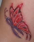 a butterfly tattoo on the back of a woman's lower body, with blue and red swirls