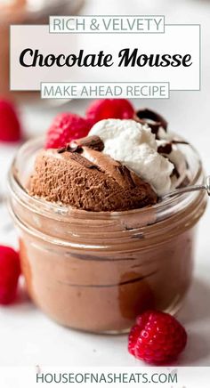 chocolate mousse in a jar with raspberries and whipped cream on top