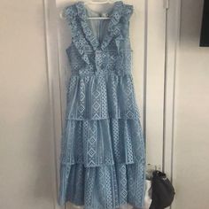 Nwt, Never Been Worn, Beautiful Midi Dress. Light Blue, Eyelet Detail, Three Tiered With Ruffles Down Chest. Zip Enclosure On Back. Feminine Blue Tiered Midi Dress, Light Blue Ruffled Midi Dress For Garden Party, Light Blue Tiered Dress With Ruffles, Blue Sleeveless Midi Dress With Ruffles, Blue Ruffled Midi Dress, Blue Tiered Lace Dress, Blue Ruffled Midi Dress For Spring, Blue Ruffled Midi Dress For Brunch, Light Blue Tiered Midi Dress