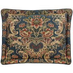 a blue and red pillow with an ornate design on the front, along with a decorative border