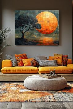 a living room filled with furniture and a large painting on the wall above it's couch