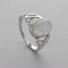 These is a beautiful Sterling Silver Ring with a Moonstone. The ring is made out of solid 925 Silver and there is no nickel or other substances causing most allergies. This makes the ring hypo allergenic. The ring is finished with a layer of Rhodium which makes the silver tarnish less. Size of the Moonstone 1.2 x 0.8 cm or  0.47 x 0.31 inch Please note: Our jewelry is photographed close up to show detail and may appear larger than they are. We use a dime coin as size reference on one of the pict Silver Bracelet Designs, Celtic Rings, Rainbow Moonstone Ring, Moonstone Ring, Pretty Jewellery, Rainbow Moonstone, Bracelet Designs, Moonstone, Statement Rings