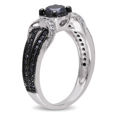 a black and white diamond engagement ring with an intricate design on the band, set in 18k white gold