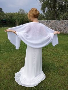 Lightweight cape chaff will complement your image of the bride. The scarf of angora is handmade can be worn after the event as white is a universal shade. The cape is very soft and delicate, and most importantly will keep you warm on a chilly evening. The product is made of natural yarn possible slight hair loss (this is inevitable). hand wash in cool water, dry away from the radiator in a horizontal position Composition: 100% angora (rabbit) Hand knit One Size Wedding Shawl, White Shawl Wrap For Wedding, White One-size Shawl Wrap, White Shawl Wrap, Winter Wedding Cape, Wedding Shrug, Shrugs And Boleros, Bridal Cape, Angora Rabbit