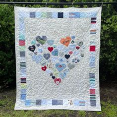 a heart quilt hanging on a clothes line