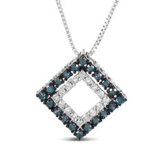 Unlike your usual oval or heart-shaped pendants, this rhombus piece is an unexpected standout. Made up of two geometric-shaped pendants featuring 36 natural round diamonds that are in white and colour-treated in blue respectively, the stones weigh a total of 1/2 cttw. While the colour combination of the diamonds adds that extra charm to the overall look, the contrasting sterling silver prong settings also undoubtedly add to its appeal. Cinched onto a .925 Sterling Silver rope chain, it’s finishe Diamond-shaped Necklace With Diamond Accents, Diamond White Necklace With Diamond Markers, Anniversary Necklace With Black Diamonds, Diamond-cut Diamond-shaped Necklaces, Diamond-shaped Necklace With Diamond Accents For Anniversary, Rhombus Design, Silver Rope Chain, Rope Chain, Sterling Silver Pendant