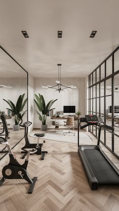 an exercise room with mirrors and treadmills in the center, potted plants on either side