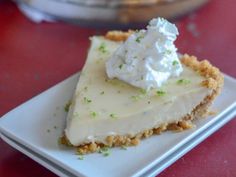 a slice of key lime pie on a white plate