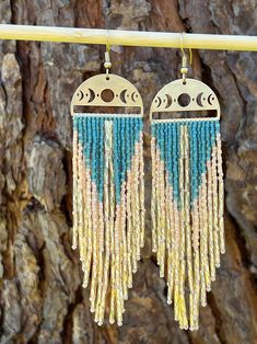 Handmade bohemian beaded fringe earrings. Festival Fringe Earrings With Round Beads, Bohemian Gold Chandelier Earrings With Tassels, Gold Bohemian Chandelier Earrings With Tassels, Bohemian Tassel Drop Earrings For Festivals, Bohemian Gold Beaded Fringe Earrings, Bohemian Gold Fringe Earrings, Gold Bohemian Beaded Fringe Earrings, Bohemian Gold Earrings With Beaded Fringe, Gold Bohemian Earrings With Beaded Fringe