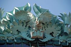 an elaborately designed sculpture on top of a building