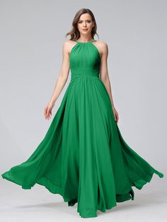 a woman in a long green dress