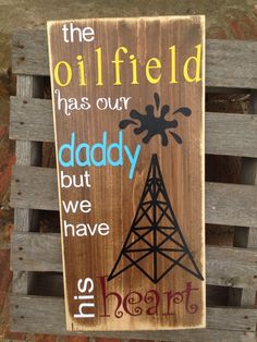 a wooden sign that says, the oilfield has our daddy but we have his heart