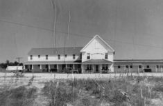 an old black and white photo of a building