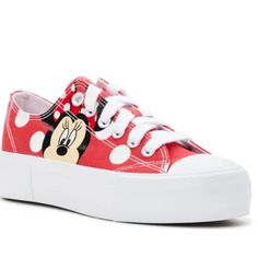 Your Style Will Come Through In These Fun Platform Canvas Shoes Featuring Minnie Mouse. This Classic Style With A Fashionable Platform Outsole Features A Red Upper With White Polka Dots, And Whimsical Minnie Art On The Side. Details: Women's Platform Canvas Shoes Easy To Clean Synthetic Canvas Upper Classic Style With Whimsical Minnie Mouse Artwork Platform Design White Sidewall White Flat Laces Gum Rubber Wipe Clean Red Round Toe Sneakers For Spring, Trendy Red Canvas Shoes For Spring, Spring Red Round Toe Sneakers, Red Flat Sneakers For Summer, Red Summer Sneakers, Cute Red High-top Sneakers, Red Low-top Sneakers For Summer, Red Lace-up Canvas Shoes For Summer, Casual Minnie Mouse Sneakers With Round Toe