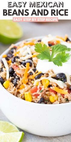 mexican beans and rice in a white bowl with cilantro, lime wedges on the side