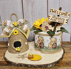 there are some decorations on top of the tree stumps that have been decorated with sunflowers