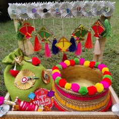 an assortment of decorative items on display in a box with the words happy diwali written below it