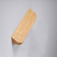 a wooden object hanging on the wall with no one in it's place to see